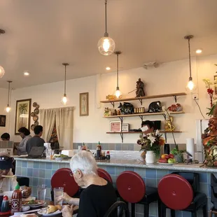 people sitting at a table in a restaurant