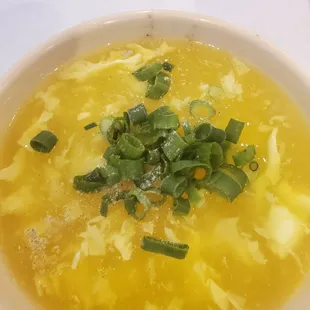 Egg drop soup with green onions added.
