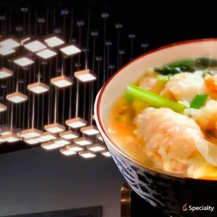 a bowl of soup with shrimp and broccoli