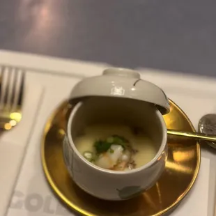 a bowl of soup on a plate