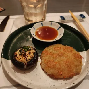 Potato pancake and spicy stuffed shiitake mushroom.