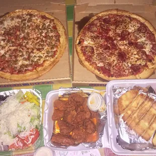 Family meal. 2 lg 1 topping pizzas, salad, wings, bread sticks and a 2 liter soda not pictured.