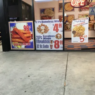 Breadsticks 99 cent 12 piece wings $4.99 20 piece wings 8 breadsticks 32 oz. soda $8.99