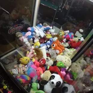 a claw machine filled with stuffed animals