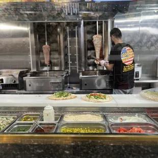 a man preparing food in a restaurant kitchen
