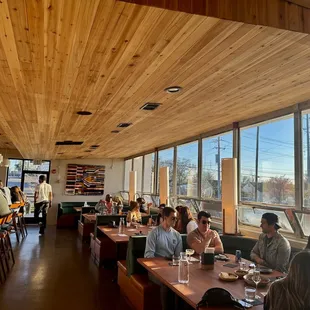 people sitting at tables in a restaurant