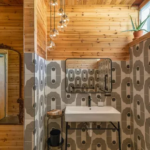 a bathroom with a sink and a mirror