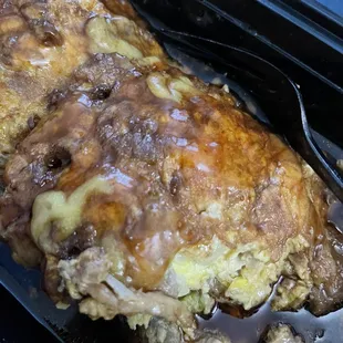 Egg Foo Young combination with small plastic objects in it