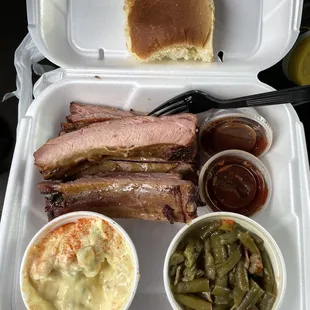 1/2 pound Rib Plate with 2 sides of choice and a roll (I got potato salad, green beans w/bacon)..Sauce on the side.
