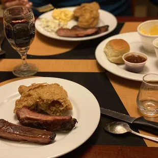 a plate of food and a glass of wine