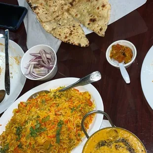 malai kofta, vegetable biryani, and garlic naan