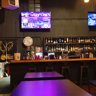 a bar with purple lighting