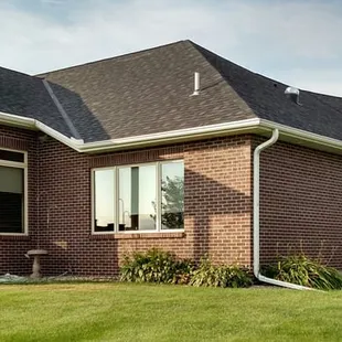 a brick house with a covered porch