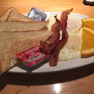The "Just Enough" breakfast selection, two eggs, toast, and either sausage or bacon