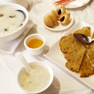 Yummy congee with century egg, sesame seed balls. Skip the dry &amp; gritty green onion pancake.