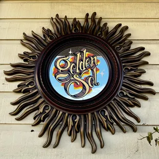 a sunburst on the side of a building