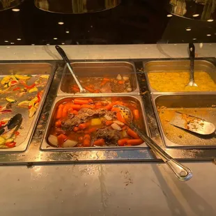 a variety of food in a buffet