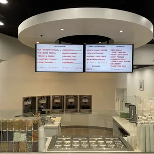 a restaurant with a menu on the wall