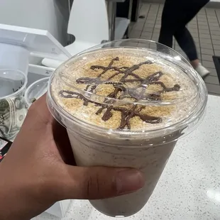 Peanut butter milkshake w/ graham cracker, peanut butter cup, and chocolate syrup toppings