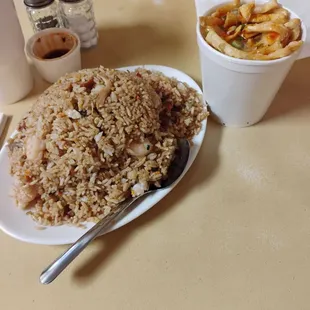 Combination fried rice meat chicken shrimp and egg drop soup with crunchies.