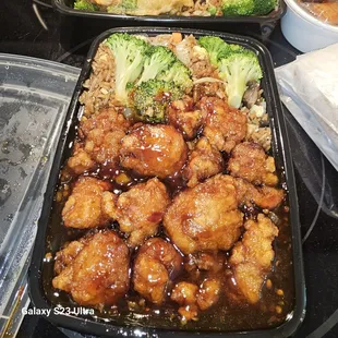a tray of chicken and broccoli