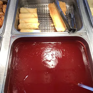 egg roll and fish and sweet &amp; sour sauces