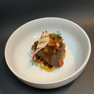 A yummy custom dish by the chef!!! It was a ribeye with a grilled onion and a mushroom gravy of some sort!! :)