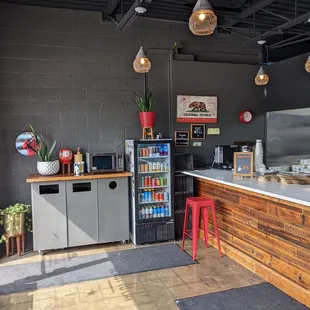 a kitchen with a counter and a refrigerator