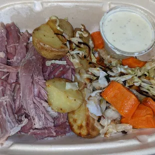 Corned beef with baked potatoes and cabbage