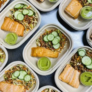 trays of salmon and vegetables