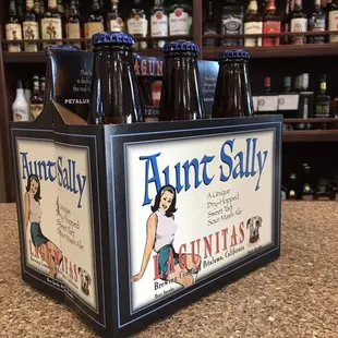 aunt sally beer bottles in a display case