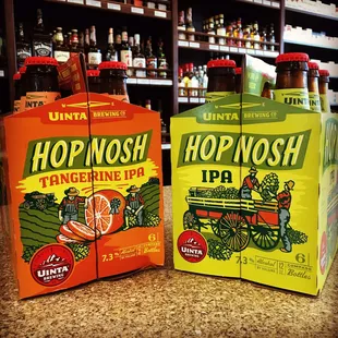 two bottles of hop mosh and a carton of hop mosh