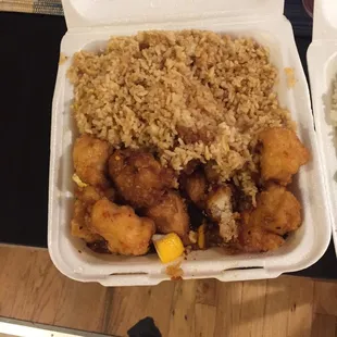 Orange chicken and fried rice. Really just brown rice with some egg in it. Still tasty enough.