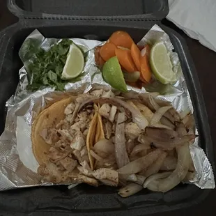 2 chicken tacos (left) and 1 brisket taco (right-buried under grilled onions).
