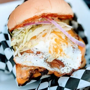 The Golden Burger with cheese + egg. Seriously one of the best burgers in town. Definitely order this!  https://www.goldentigeratx.com/