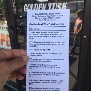 Front page of the take-out menu for Golden Tusk