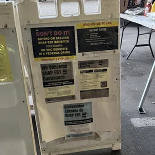 a white refrigerator with stickers on it