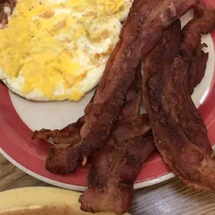 Extra crispy bacon eggs over hard