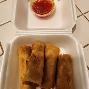 Egg rolls with sweet &amp; sour sauce.