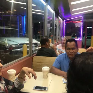 a group of people sitting at a table