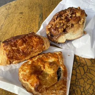 Mushroom empanada, chocolate croissant, pecan bun