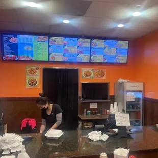 a woman preparing food in a restaurant