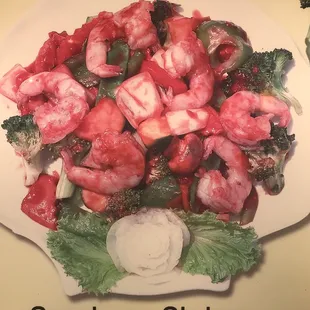 a plate of shrimp and broccoli
