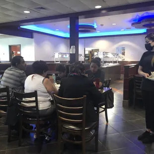 a waitress serving customers