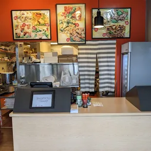 Order and pickup area with the kitchen behind it
