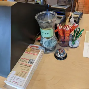 Takeout menu, bell, tip jar, and more