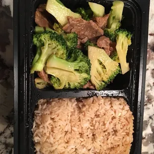 Beef and broccoli with fried rice.