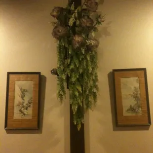 a cross decorated with flowers