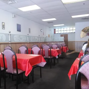 empty restaurant with red tablecloths