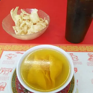 a bowl of soup and a bowl of chips